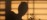 Practitioner’s shadow filtered through a latticed window