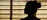 Interior silhouette of practitioner in still - grounded pause