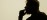 Interior silhouette of practitioner framed in a doorway